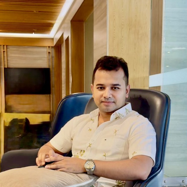 Noor Mohammad, founder and creator of ReactBD, seated with hands folded